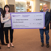 Erin Hsu and Jonathan Rivnay accept a Catalyst Award check for $55,000.